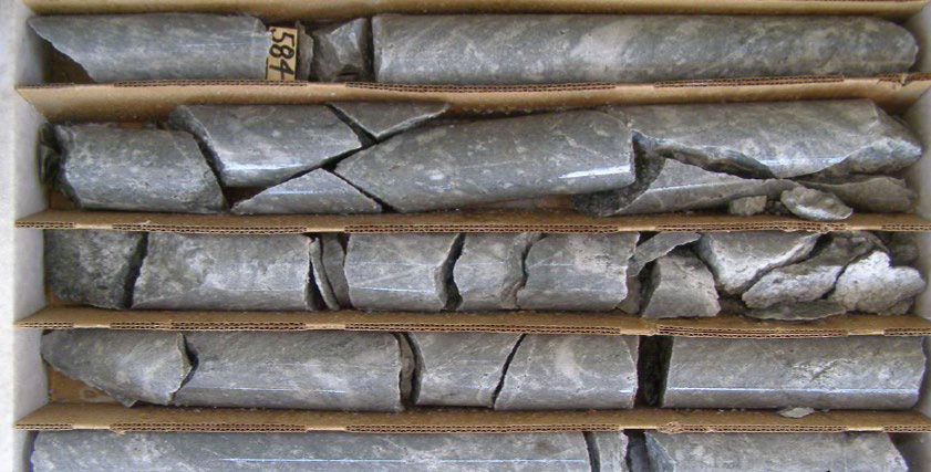 Alaskite-hosted molybdenum (chalcopyrite-pyrite) mineralization (683.5-ft depth) in Yuma Mine area (YK-02B1)